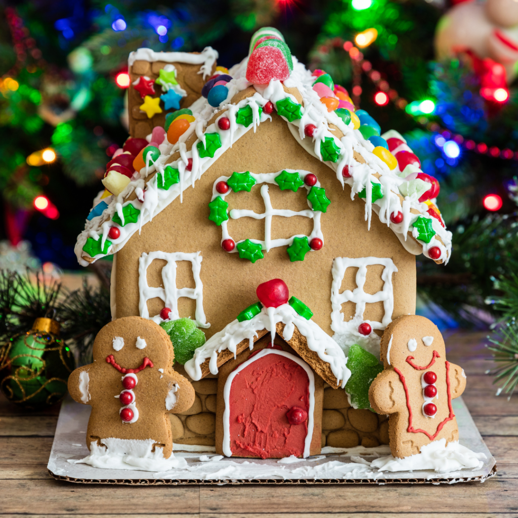 gingerbread house with gingerbread cookies flanking door